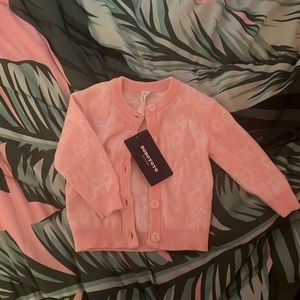 Pink and white bow sweater